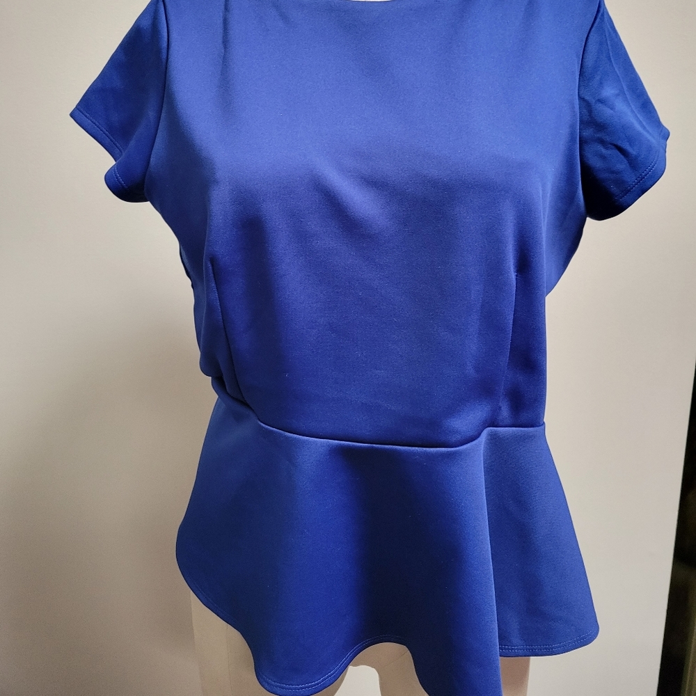 Peplum Bisou Bisou top in Blue.